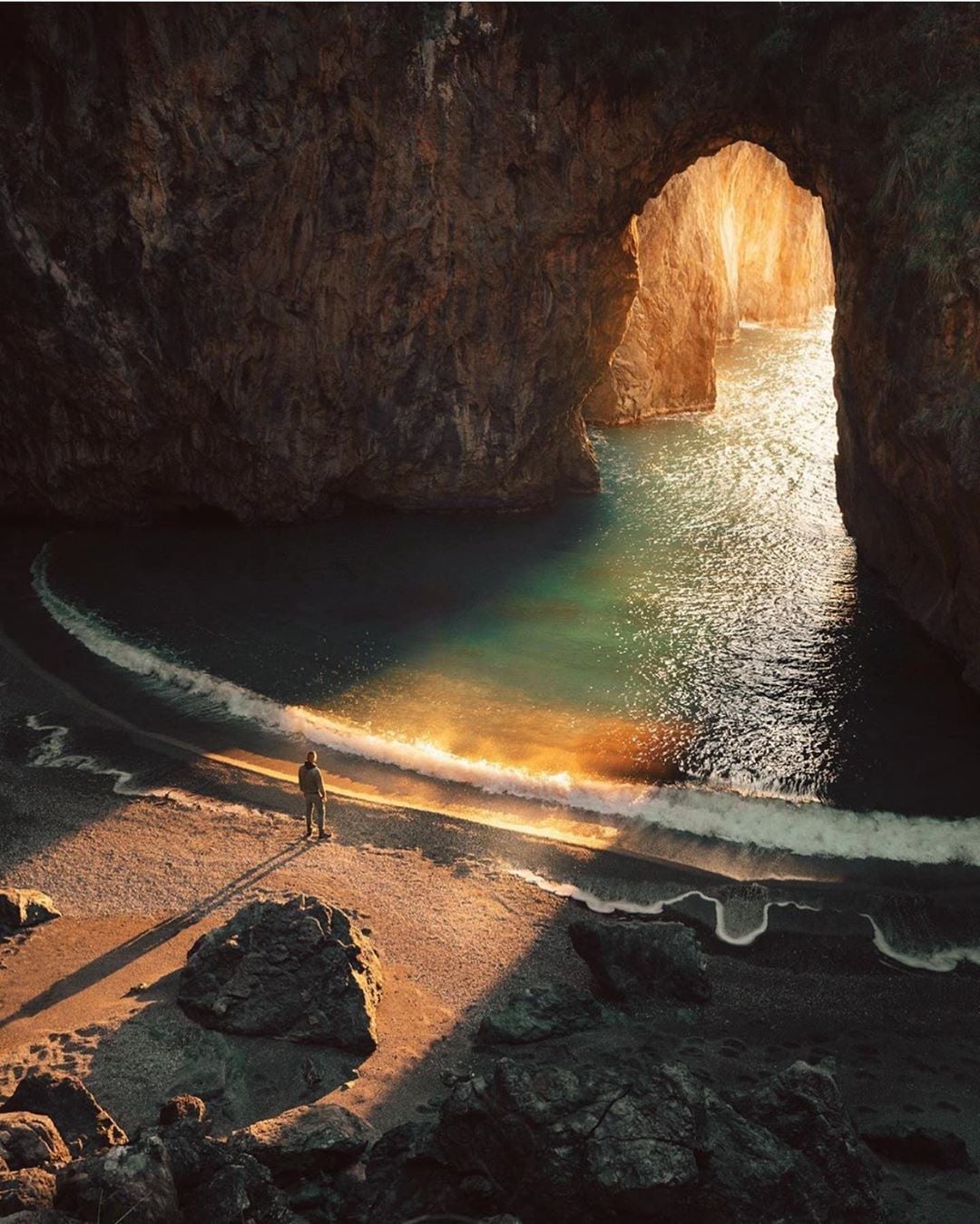 sunset photography cave beach in italy by brahmino