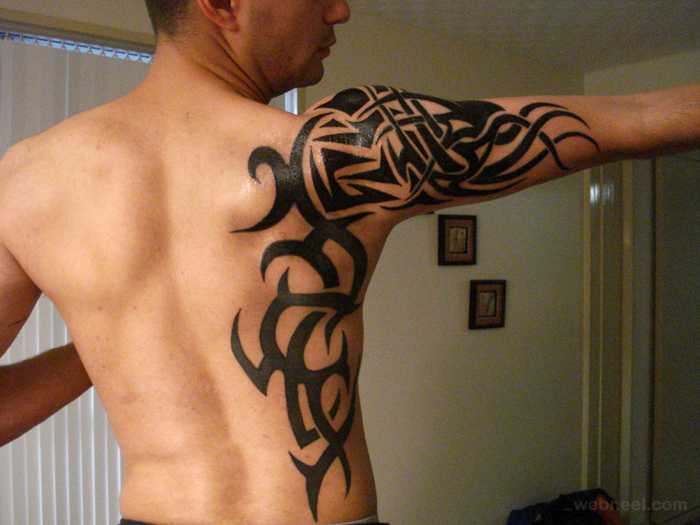 Shoulder Blade Tribal Tattoo - Tattoo Ideas and Designs | Tattoos.ai