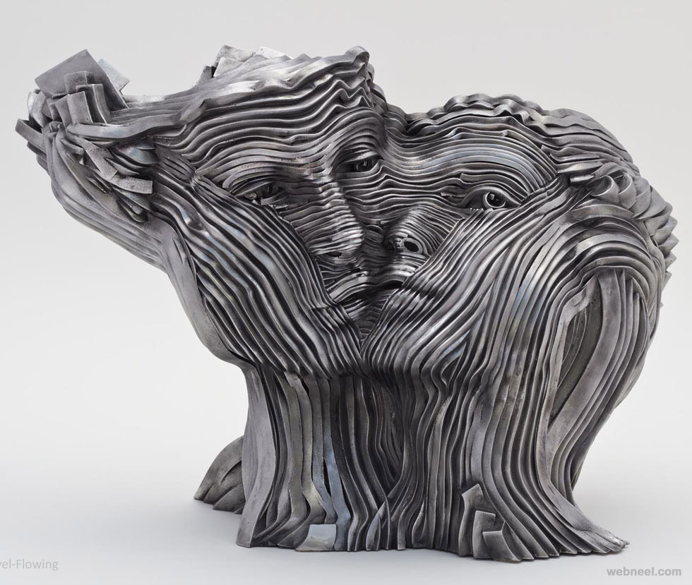 couple face steel scultpure by gil bruvel