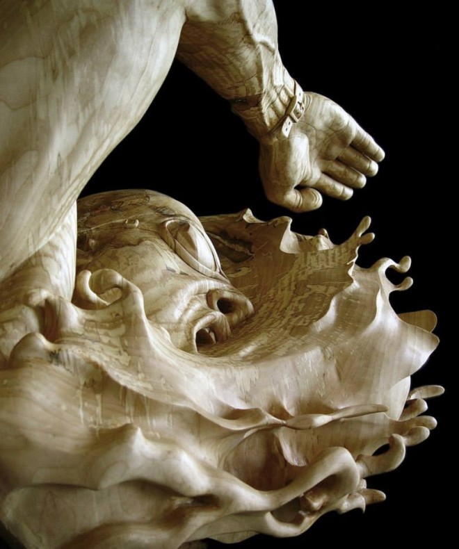swimming wood sculpture by stefanie rocknak