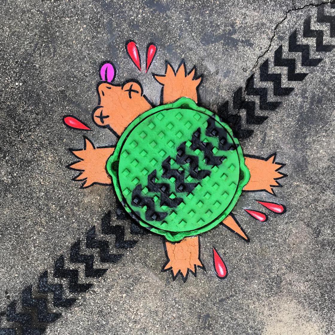 street art works turtle smash by tom bob