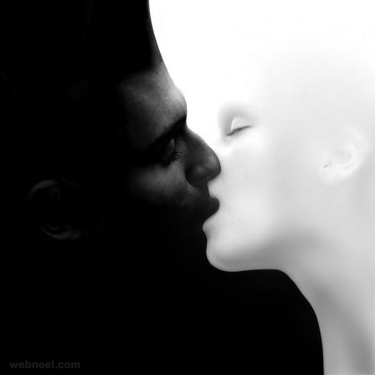 black man and white woman kissing