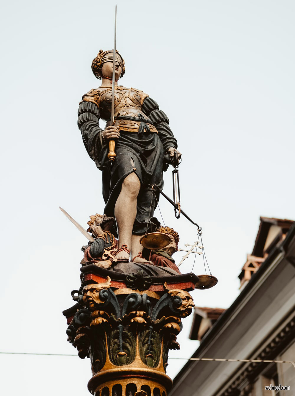 full round sculpture depicting justice