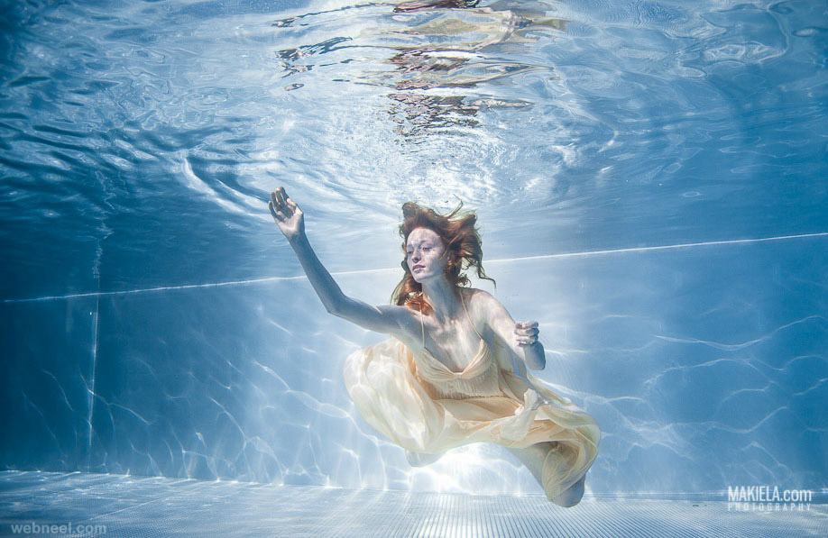 woman underwater photography by rafal makiela