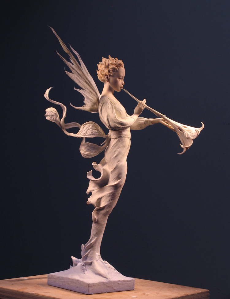 sculpture fairy playing musical instrument by herald