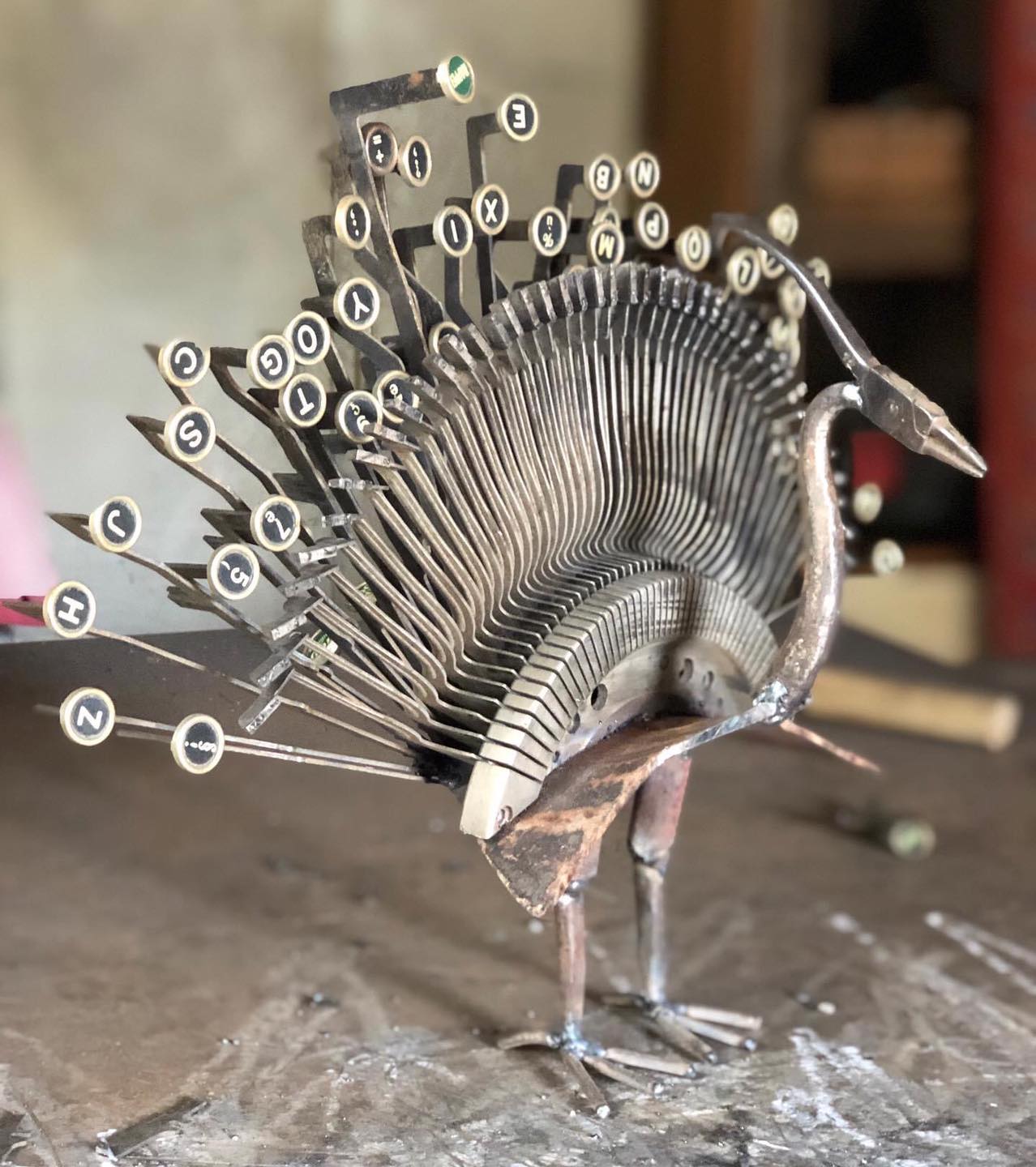 metal sculpture peacock recycled by thierry gall