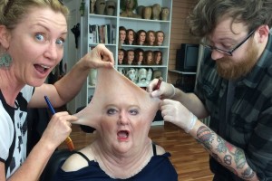 sculpting silicone prosthetic makeup on a model by makeup effects group