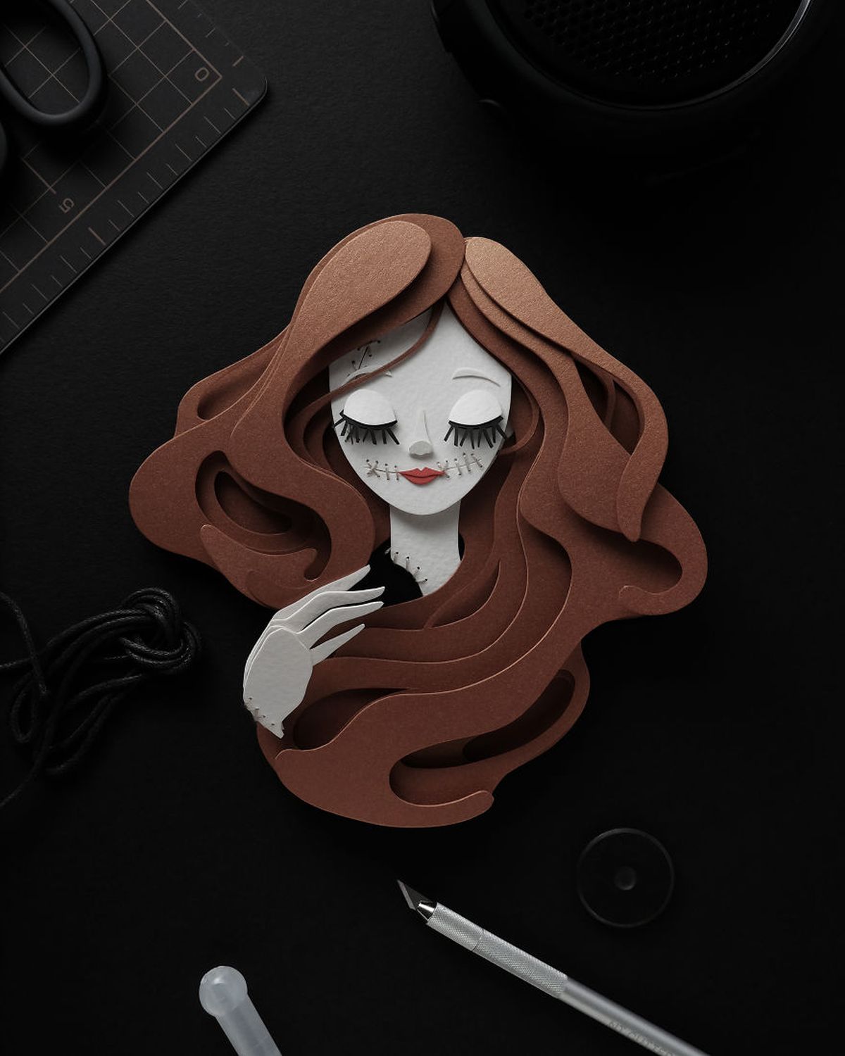 3 paper cut sculptures by john